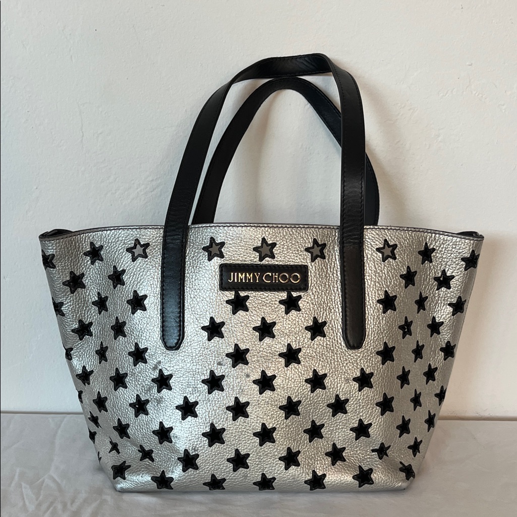 Jimmy Choo Metallic Silver Tote With Black Cut-Out Stars And Detachable Pouch